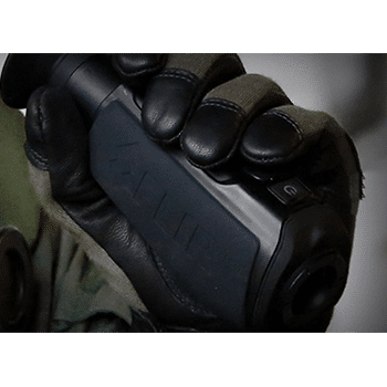 Photo of a hand holding a Teledyne FLIR Scout LS-X/R thermal monocular.