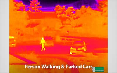 FLIR Scout TK thermal view of person walking by parked cars