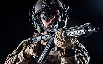 Soldier With Trijicon IR-PATROL Thermal Monocular Mounted on Rifle